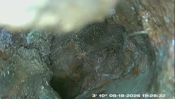 Sewer inspection camera footage of the inside of a drain pipe