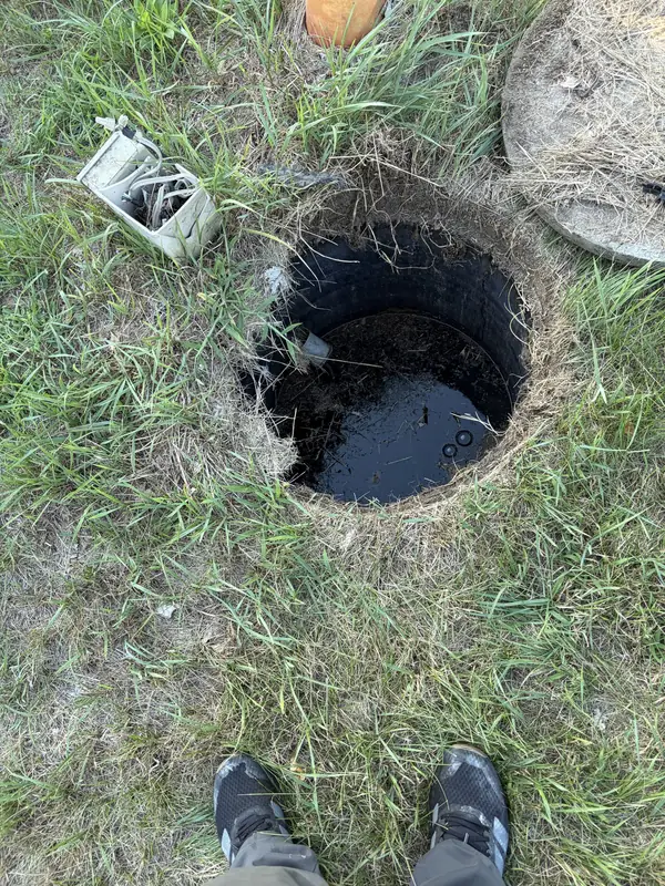 Exterior sewer cleanout access point in a yard